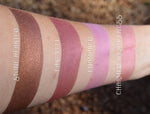 Rouged swatched on the skin of inner arm.