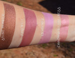 Rouge shades swatched on the inner arm.