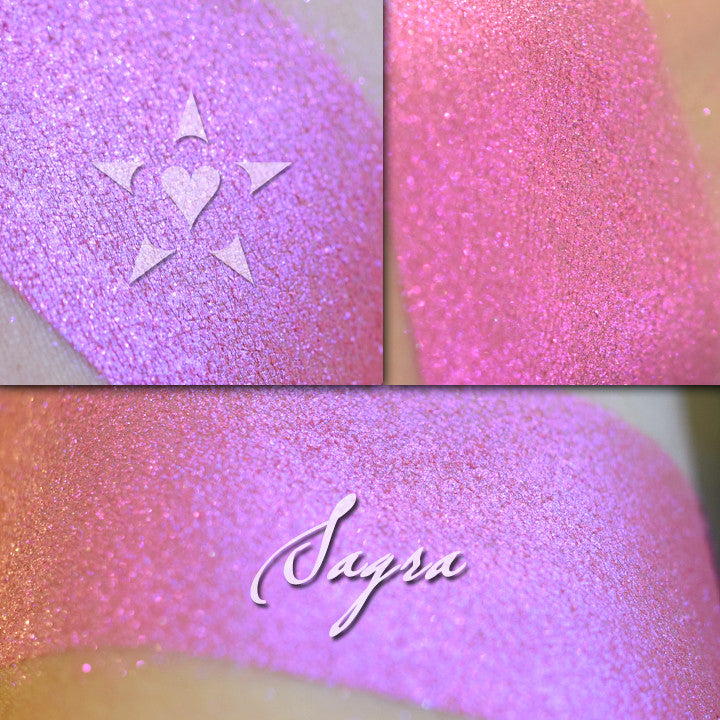 SAGRA - Vintage Aromaleigh Eyeshadow swatched on the skin in three views. A vibrant pink base with red to violet color travel iridescence. T