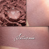 SATURNIA- - Multipurpose Contour/Eyeshadow loose and swatched on the skin. Chestnut brown. 