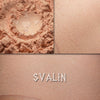 Svalin matte eyeshadow shown loose and swatched on the skin.  A pale golden peach matte