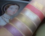 Skin swatches showing products within the Catherine Howard collection. Aristocratic is the third from left, Gray/Taupe with strong golden glow.