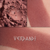VERDANDI matte eyeshadow shown loose and swatched on the skin. Midtone/Deep chocolate with warm russet tones
