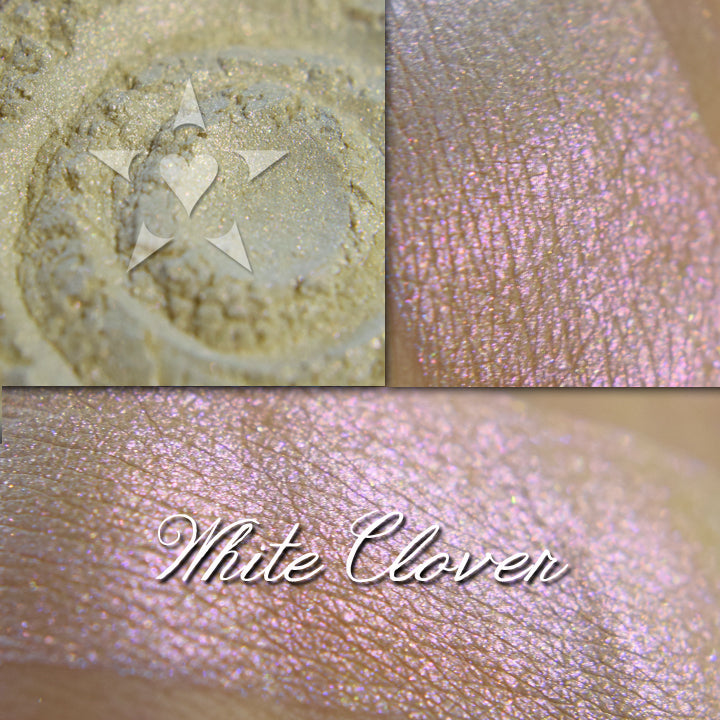 White Clover eyeshadow loose and swatched on the skin.  A pale cream with strong pink/red shift.