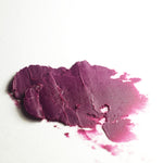 Image shows a swatch of the lip color Acanthaster, soft warm purple tint 