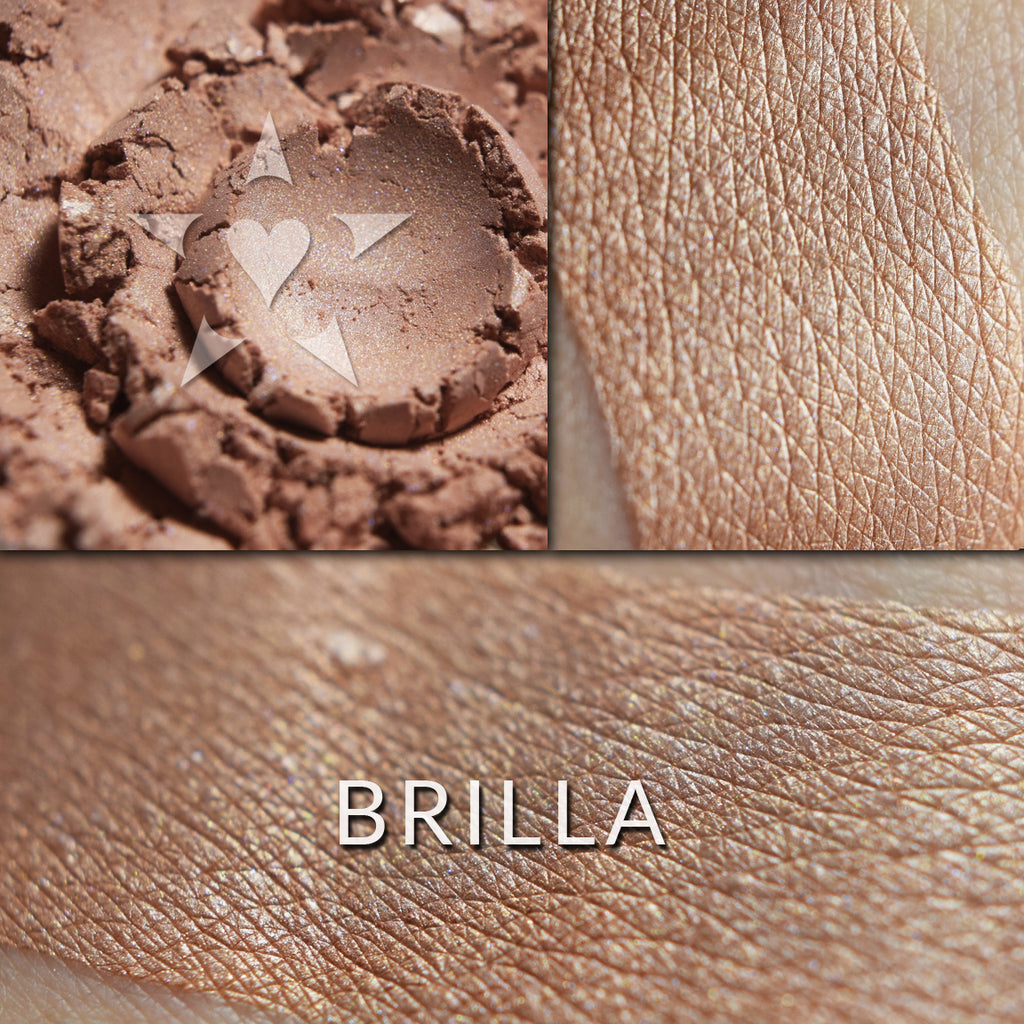 BRILLA - Multipurpose Illuminator loose and swatched on the skin. BRILLA- A warm toned buff with hints of pinky peach.