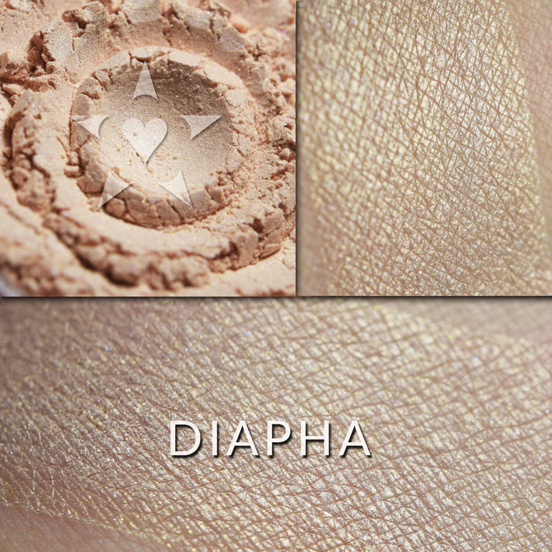 DIAPHA - Multipurpose Illuminator loose and swatched on the skin. DIAPHA: A delicate peach shade with a slight rose-gold highlight.