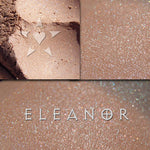 ELEANOR eyeshadow shown loose and swatched on the skin. delicate peach with magical highlights