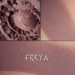 FREYA matte finish eyeshadow shown loose and swatched on the skin. Midtone-Deep russet brown with mauve tones. 