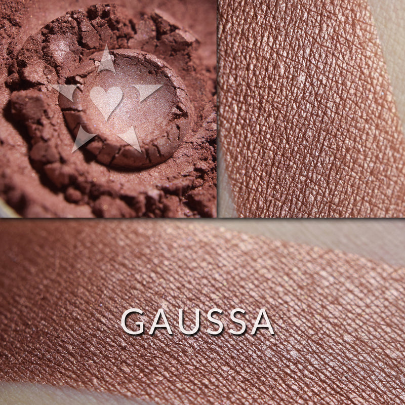 GAUSSA - Multipurpose Illuminator loose and swatched on the skin. GAUSSA- A deeper-toned, coppered cocoa berry shade.