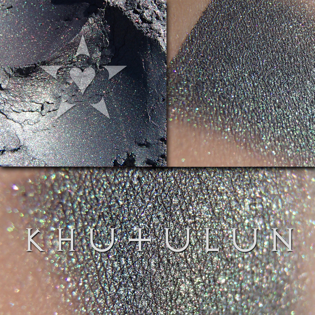 KHUTULUN eyeshadow loose and swatched on the skin. Khutulun can appear dominantly deep green or purple depending on the light.