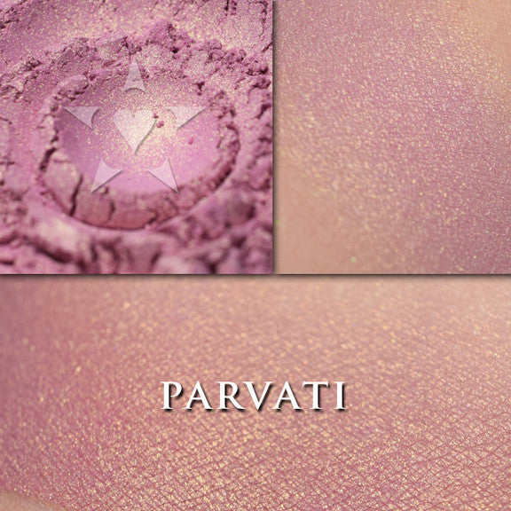 Parvati rouge loose and swatched on the skin. PARVATI is a cool rose tone with a golden glow.